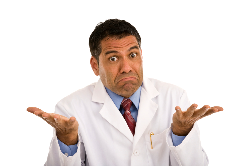 Puzzled male shrugging wearing lab coat